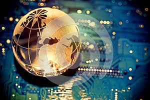 World transparent globe earth on computer motherboard. Global communications business concept. Toned