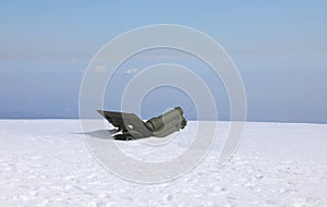 World War I cannon completely submerged by snow in winter in the mountains