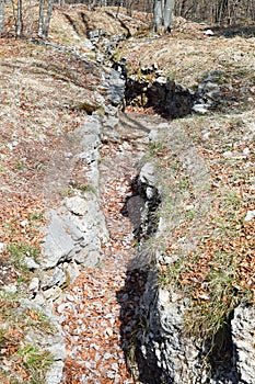 World War I trench dug on mountain rock in northern Italy photo