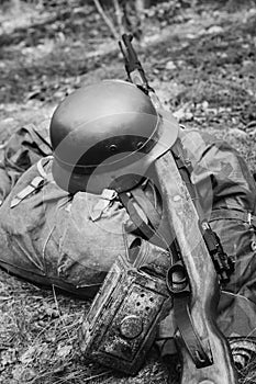 World War II German Wehrmacht Soldier Ammunition Of World War II On Ground. WWII Military Helmet, Lights, Rifle Mauser