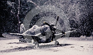 World war II military aircraft with heavy snowfall