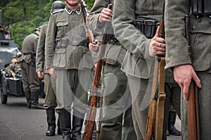 World war II soldiers and armored vehicles enter the city