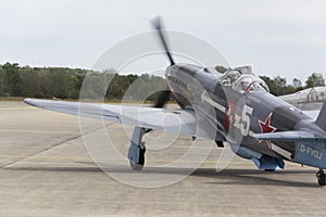 World War II Soviet fighter Yakovlev Yak-3 on runway at the CIAF - Czech international air fest on September 5, 2015 in Hradec