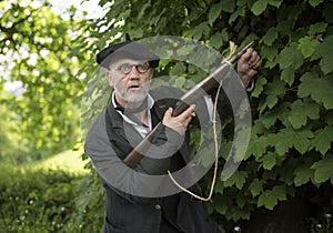 World war two French resistance soldier in the woods with a rifle gun.