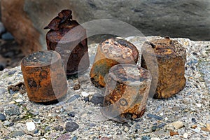 World war two munitions and ordnance on beach. photo