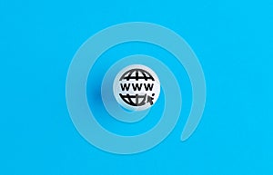 World wide web www symbol on a ball button on blue background