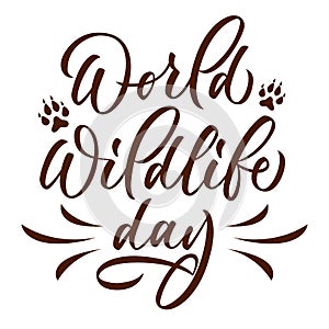 World wildlife day- calligraphic inscription with paws. Isolated lettering on white background. Vector.
