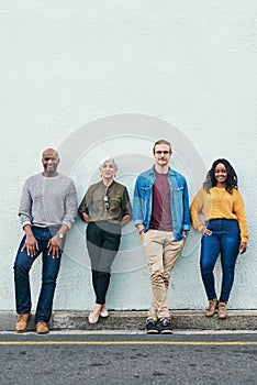 The world will know all about us pretty soon. Full length shot of a group of businesspeople standing in line against a