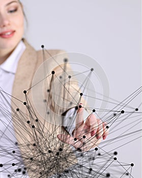 Worldwide network or wireless internet connection futuristic concept. Woman working with linked dots.