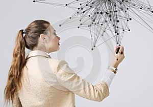 Worldwide network or wireless internet connection futuristic concept. Woman working with linked dots.