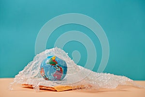 Worldwide package delivery service. International shipping. Purchasing transportation. Parcel box, globe, bubble wrap