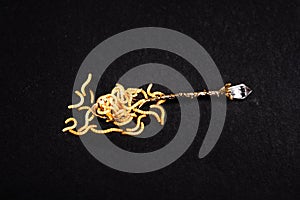 Worms in a spoon, on an isolated disgusting background