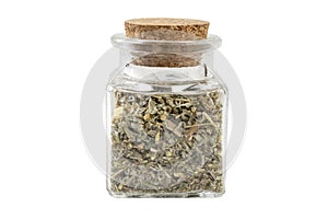 wormwood herb or in latin Absinthii herba herb in a glass jar isolated on white background. medicinal healing herbs.