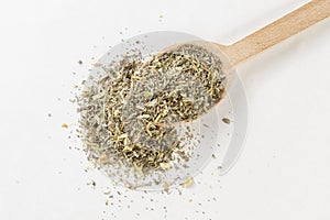 Wormwood herb or in latin Absinthii herba herb or in wooden spoon isolated on white background. medicinal healing herbs.