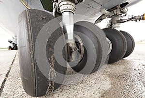 Worn aircraft chassis. Old tire in disrepair