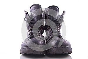 Worn black army boots