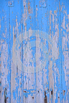 Worn Blue Wooden Door with Peeling Paint