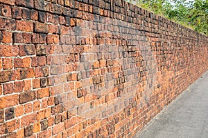 Worn brick wall along the dock road Birkenhead Wirral August 2019