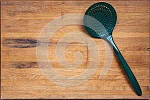 Worn Butcher Block Cutting Board with Ladle