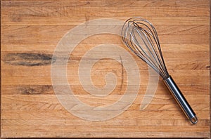 Worn Butcher Block Cutting Board with Whisk