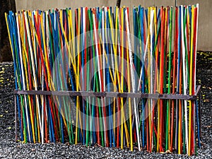 worn colorful sticks standing loosely and unsystematically arranged