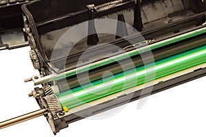 Worn disassembled printer cartridge with gears and a photoreceptor