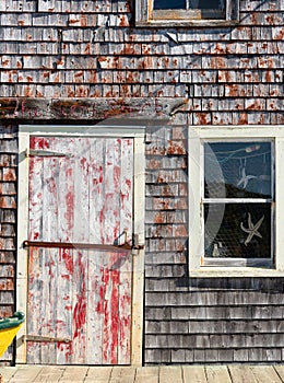 Worn house facade in Peggy's Cove, Nova Scotia Canada
