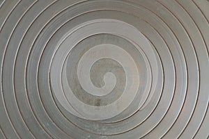 worn metal texture, concentric circles, made with a potter\'s wheel plate