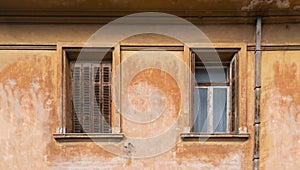 Old fashioned wooden windows, on grunge wall background