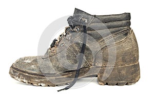 Worn-out old work boot, isolated on white background with shadow