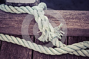 Worn out thick mooring rope.