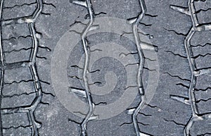 Worn out tread on a truck tire.