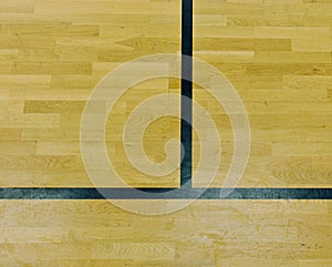 Worn out wooden floor of sporting hall with black red marking lines.