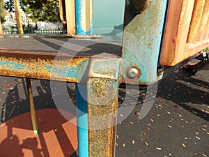Worn paintwork and rusty steel detail photo