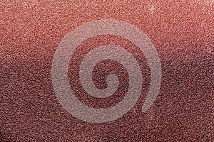 Worn texture of sandpaper, close-up abstract background