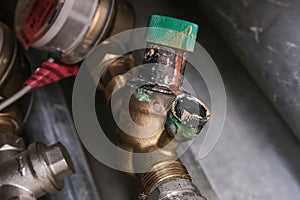 Worn woter supply equipment, leaking corroded water flow regulator, reducer, plumbing repair concept