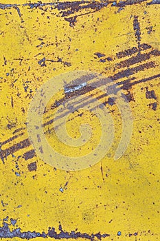 Worn yellow paint on metal sheet texture