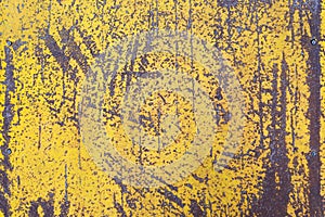 Worn yellow paint on metal sheet texture