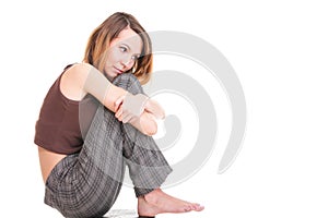 Worried and afraid young woman sitting on chair. Isolated