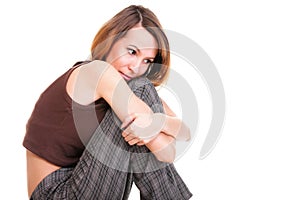 Worried and afraid young woman sitting on chair. Isolated