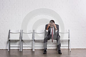 worried african american businessman waiting