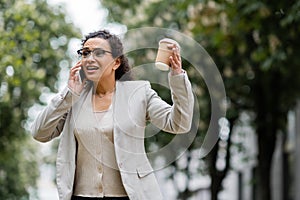 worried african american businesswoman with coffee