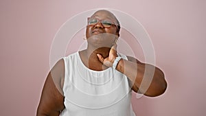 Worried african american woman, overweight and with braids, suffering serious cervical pain, unhappily standing over an isolated