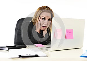 Worried attractive businesswoman in stress working with laptop c