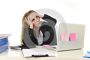 Worried attractive businesswoman in stress working with laptop c