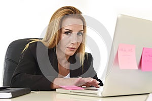 Worried attractive businesswoman in stress working with laptop c
