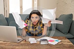 Worried attractive woman managing expenses with laptop. living cost and paying bills problem