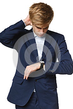 Worried business man looking at wrist watch