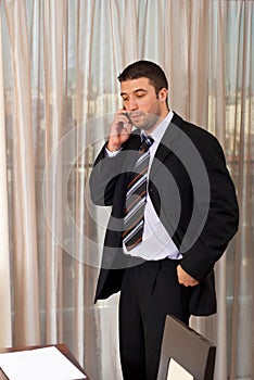 Worried business man talking on phone mobile