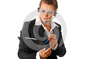 Worried business woman with headset and clipboard